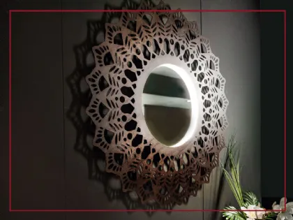 Specchio Corten Grimilde lumen in acciaio corten ispirato agli antichi “centrini”.  Il centrino era un piccolo manufatto realizzato con l’uncinetto, il tombolo, i ferri da maglia. Aveva solitamente una funzione decorativa. Con la sua forma tondeggiante, m